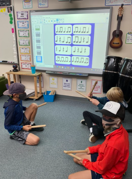 students learning drumming