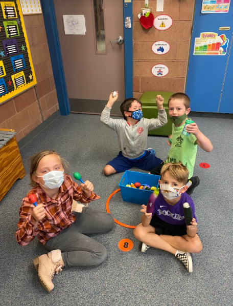 students with maracas